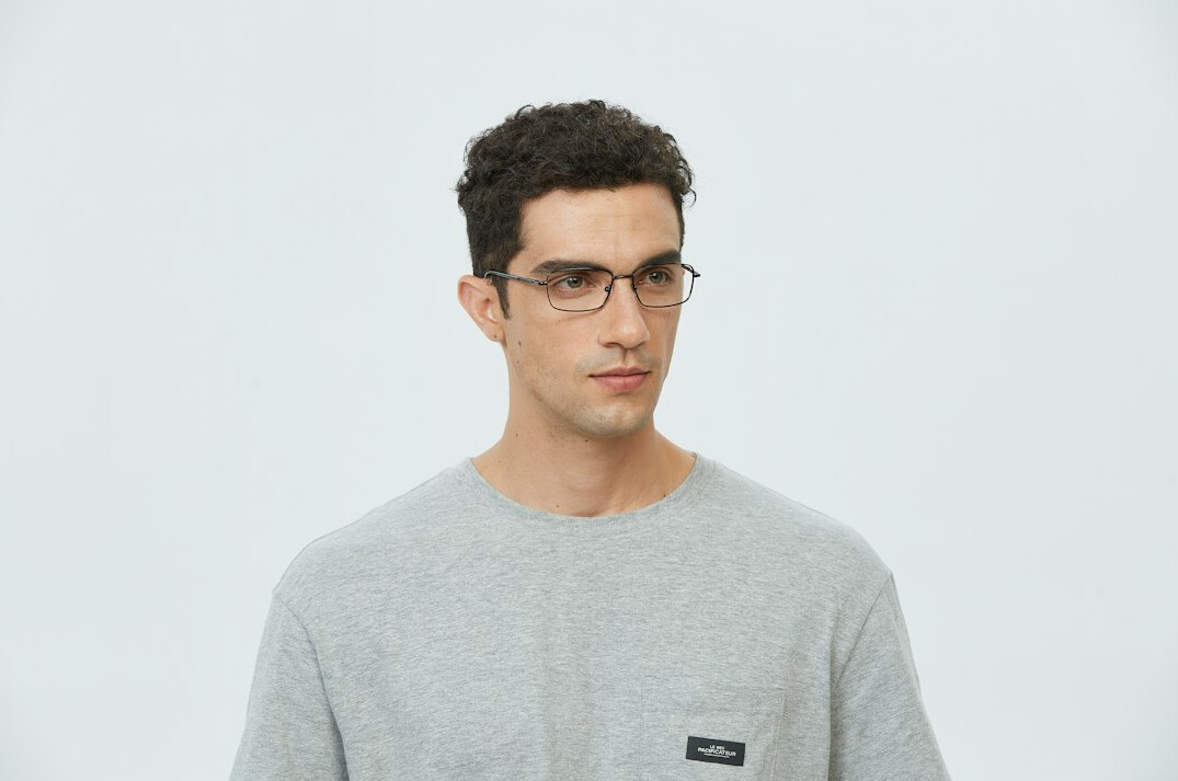 Studio portrait of a middle-aged man with glasses
