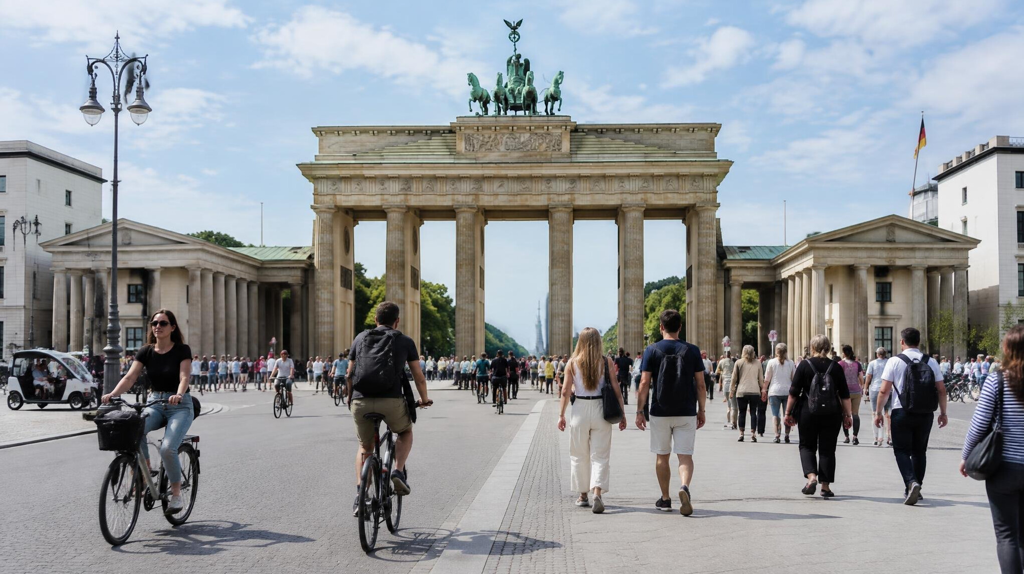 Pedestrians walking past the Brandenburg Gate today