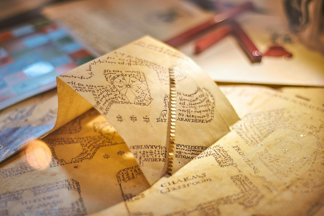 Old map with a brass compass and handwritten annotations